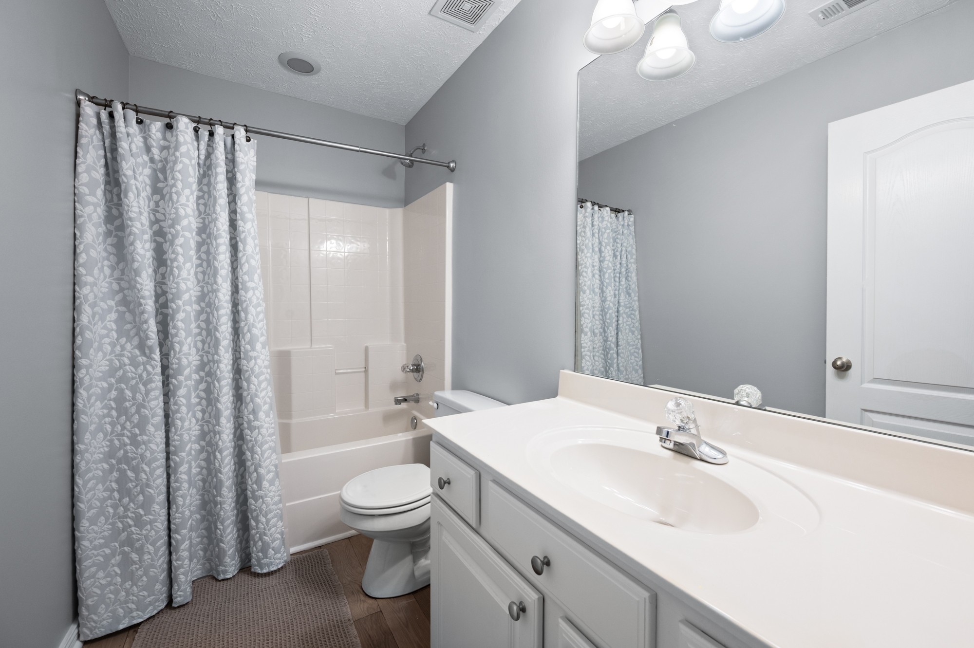 7203 Blue Ridge Drive Fairview, TN 37062 - Photo 36 of 65 a bathroom with a double vanity sink toilet mirror and shower