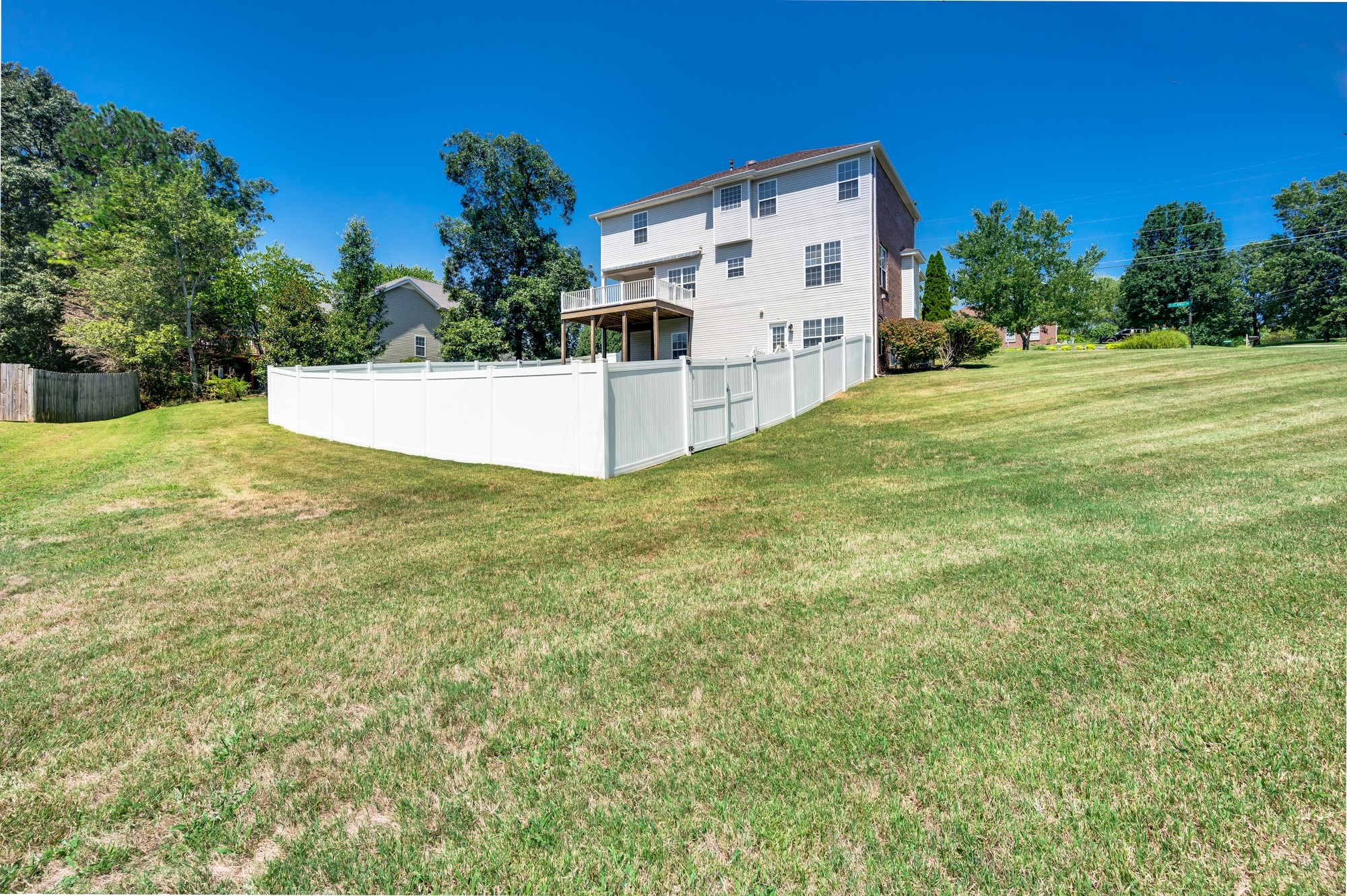 7203 Blue Ridge Drive Fairview, TN 37062 - Photo 56 of 65 a view of a white house with a yard
