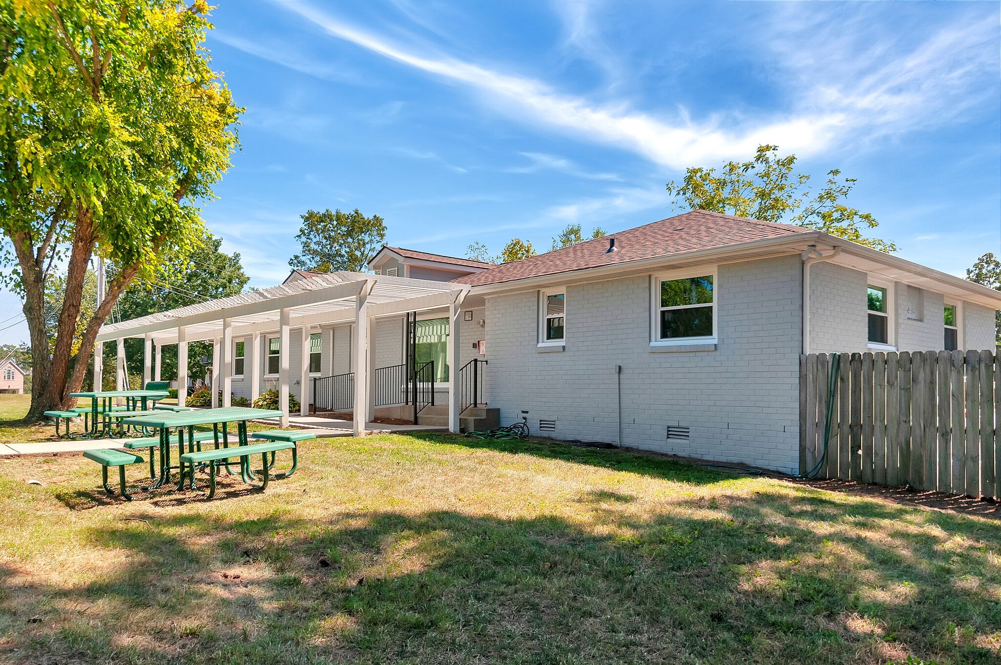 7203 Blue Ridge Drive Fairview, TN 37062 - Photo 59 of 65 a backyard of a house with table and chairs and potted plants
