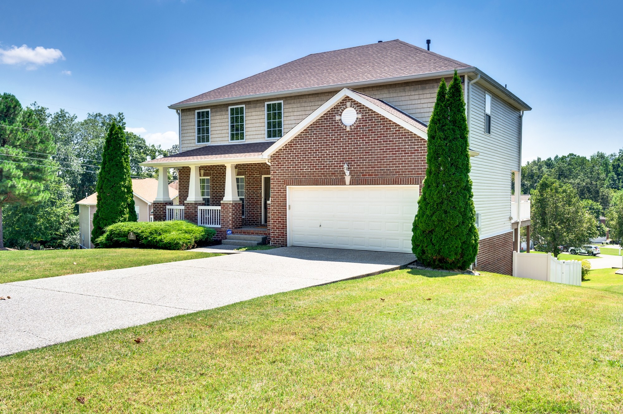 7203 Blue Ridge Drive Fairview, TN 37062 - Photo 6 of 65 a front view of a house with a yard and garage