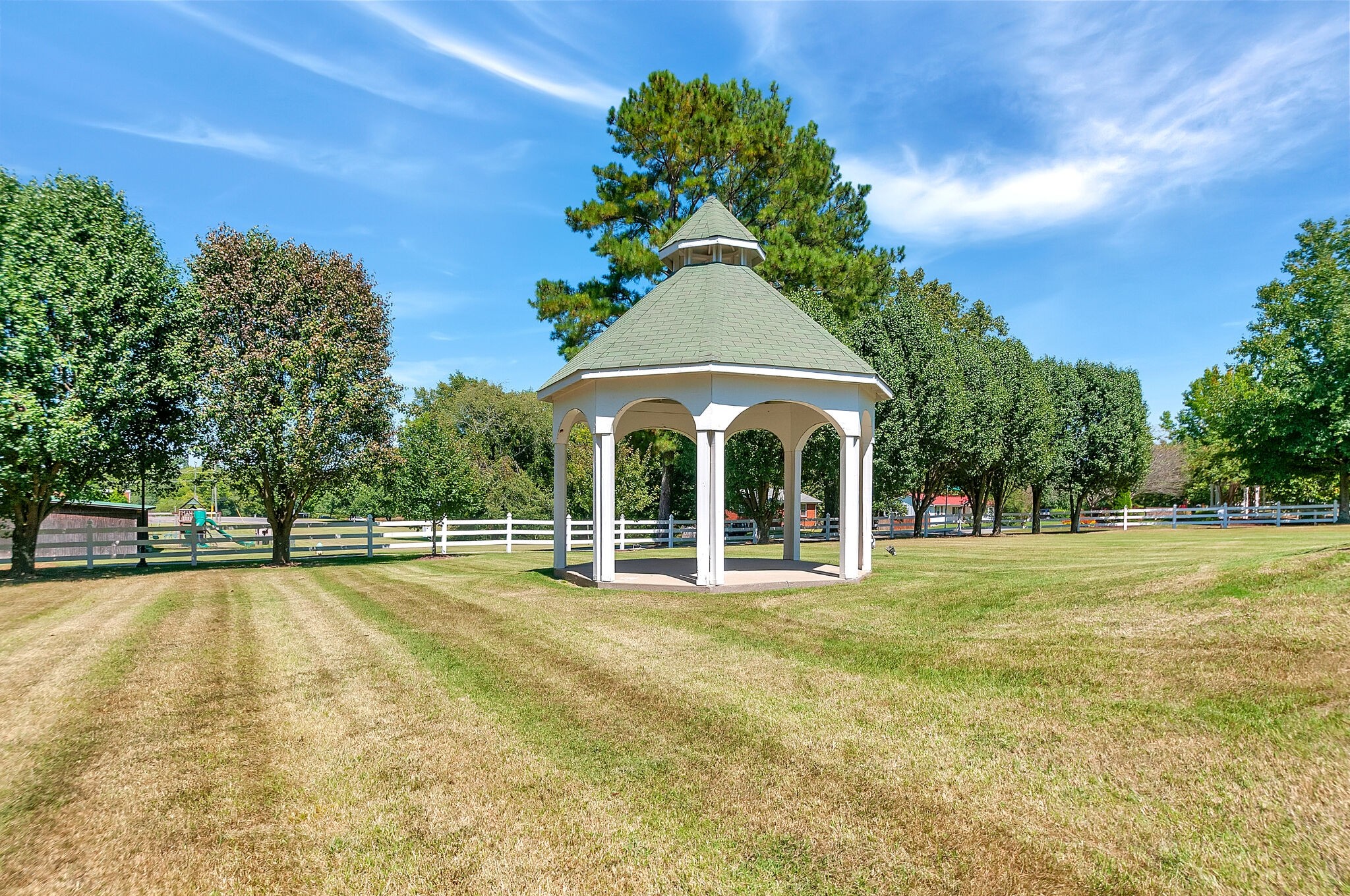 7203 Blue Ridge Drive Fairview, TN 37062 - Photo 61 of 65 a view of a swimming pool with a lawn chairs under an umbrella
