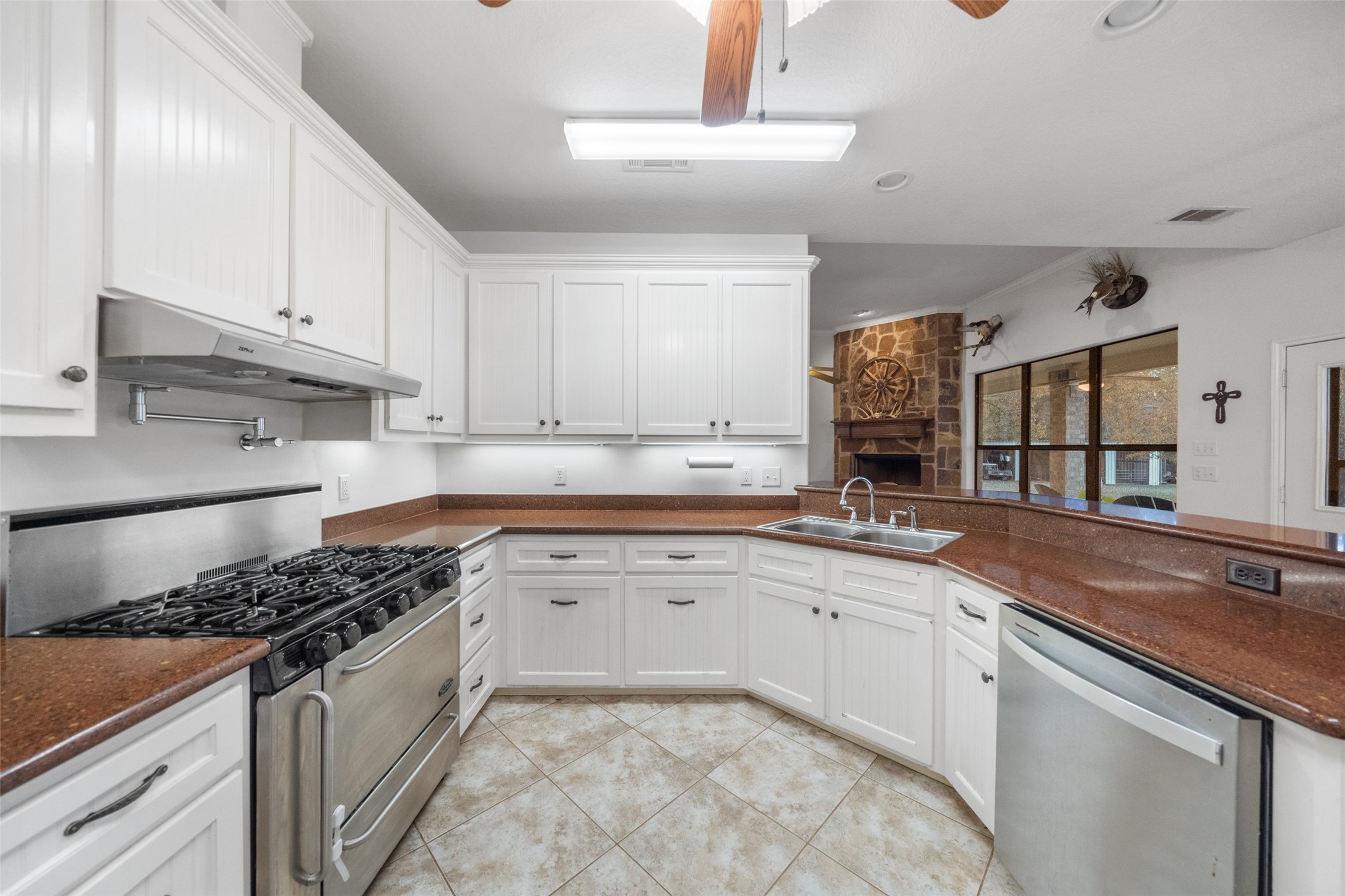 394 Farm To Market 230 Trinity, TX 75862 - Photo 13 of 34 a kitchen with granite countertop a sink stove and cabinets