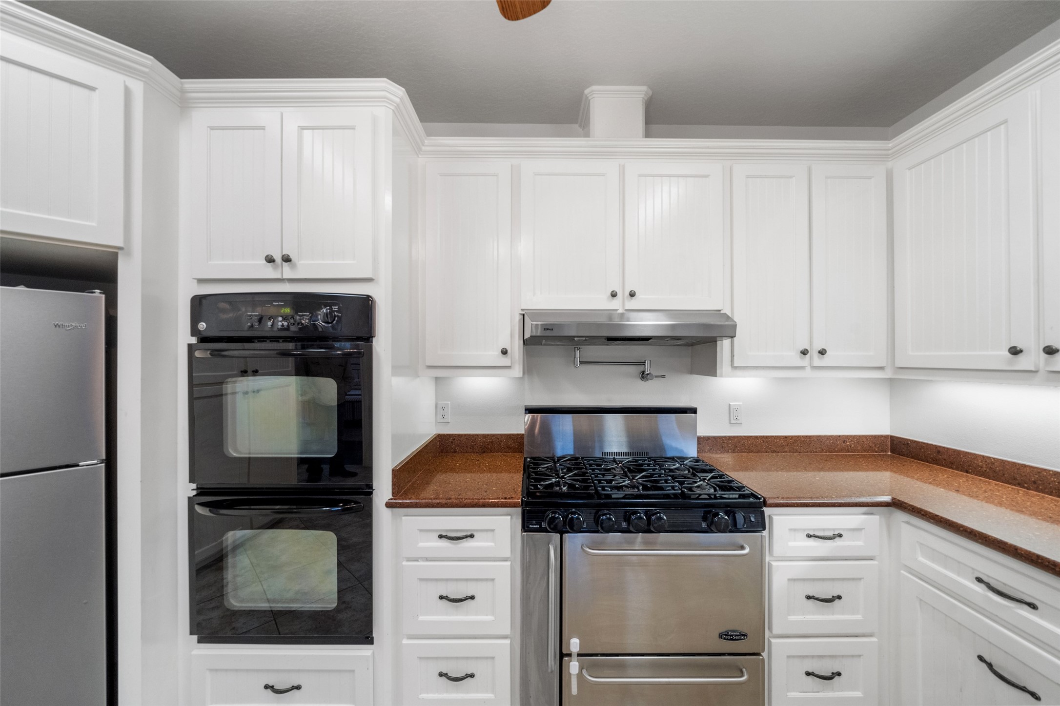 394 Farm To Market 230 Trinity, TX 75862 - Photo 14 of 34 a kitchen with granite countertop a stove and a white cabinets