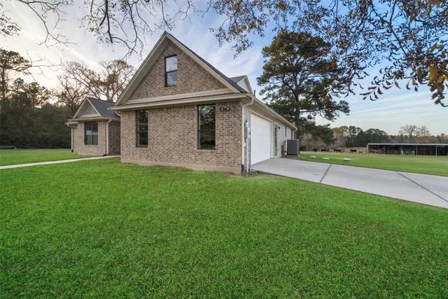 a view of a house with backyard porch and sitting area