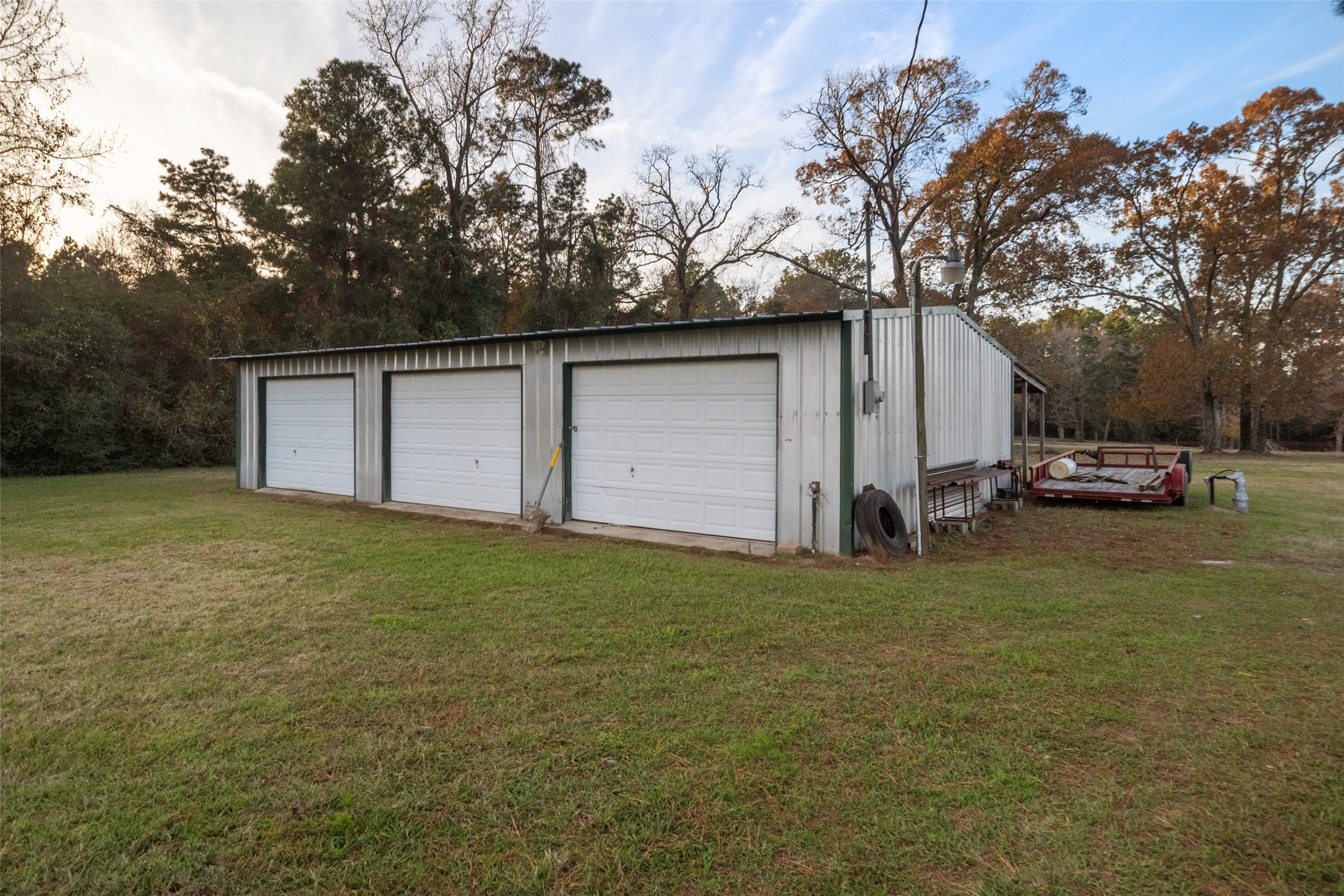 394 Farm To Market 230 Trinity, TX 75862 - Photo 31 of 34 a backyard of a house with lots of green space