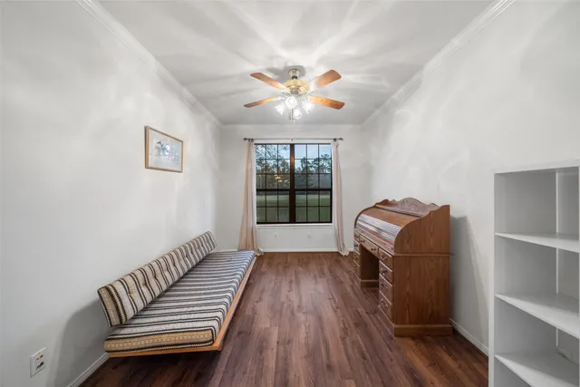 a living room with furniture a chandelier and a flat screen tv
