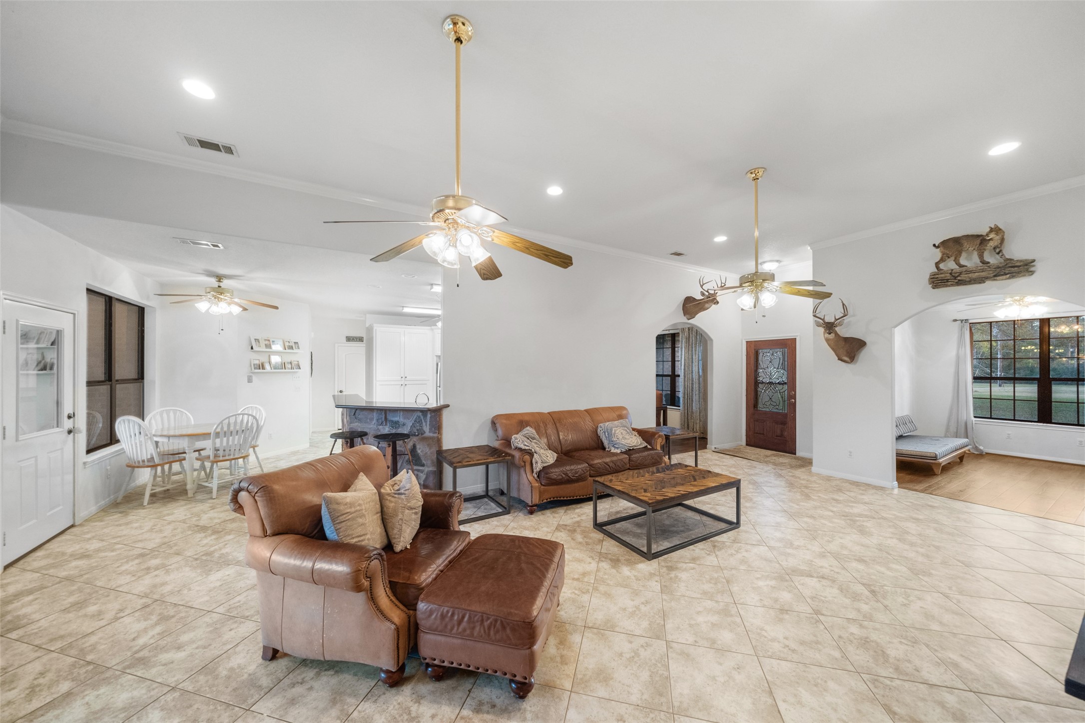 394 Farm To Market 230 Trinity, TX 75862 - Photo 10 of 34 a living room with fireplace furniture and a chandelier