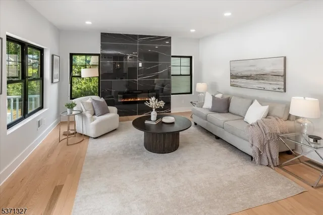 a living room with furniture and a table