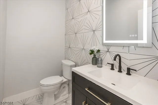 wooden floor in an empty room with a staircase