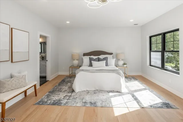 a bedroom with furniture and a window