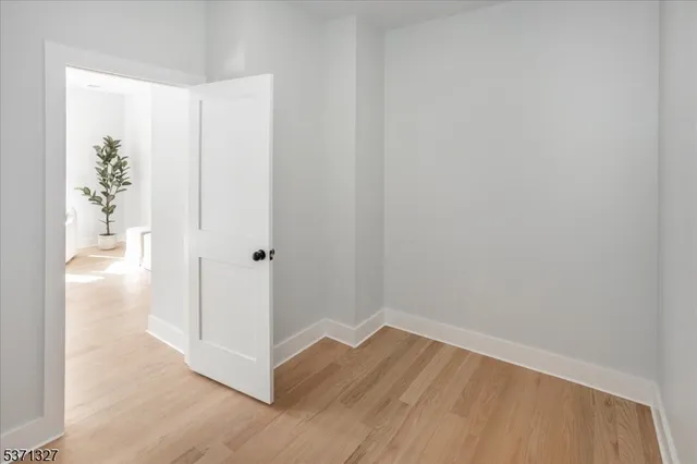 a bathroom with a granite countertop sink mirror vanity and toilet