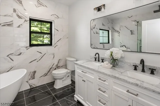 a bathroom with a bathtub and shower