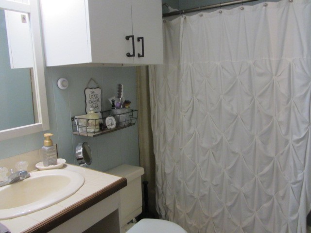 313 Jenkins Road Huntsville, TX 77320 - Photo 12 of 33 a bathroom with a sink and a mirror