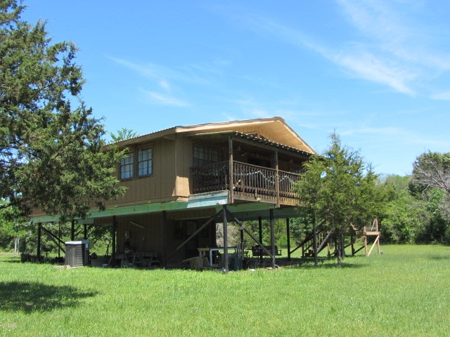 313 Jenkins Road Huntsville, TX 77320 - Photo 33 of 33 a front view of house with a garden