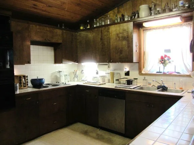 a kitchen with a sink and cabinets