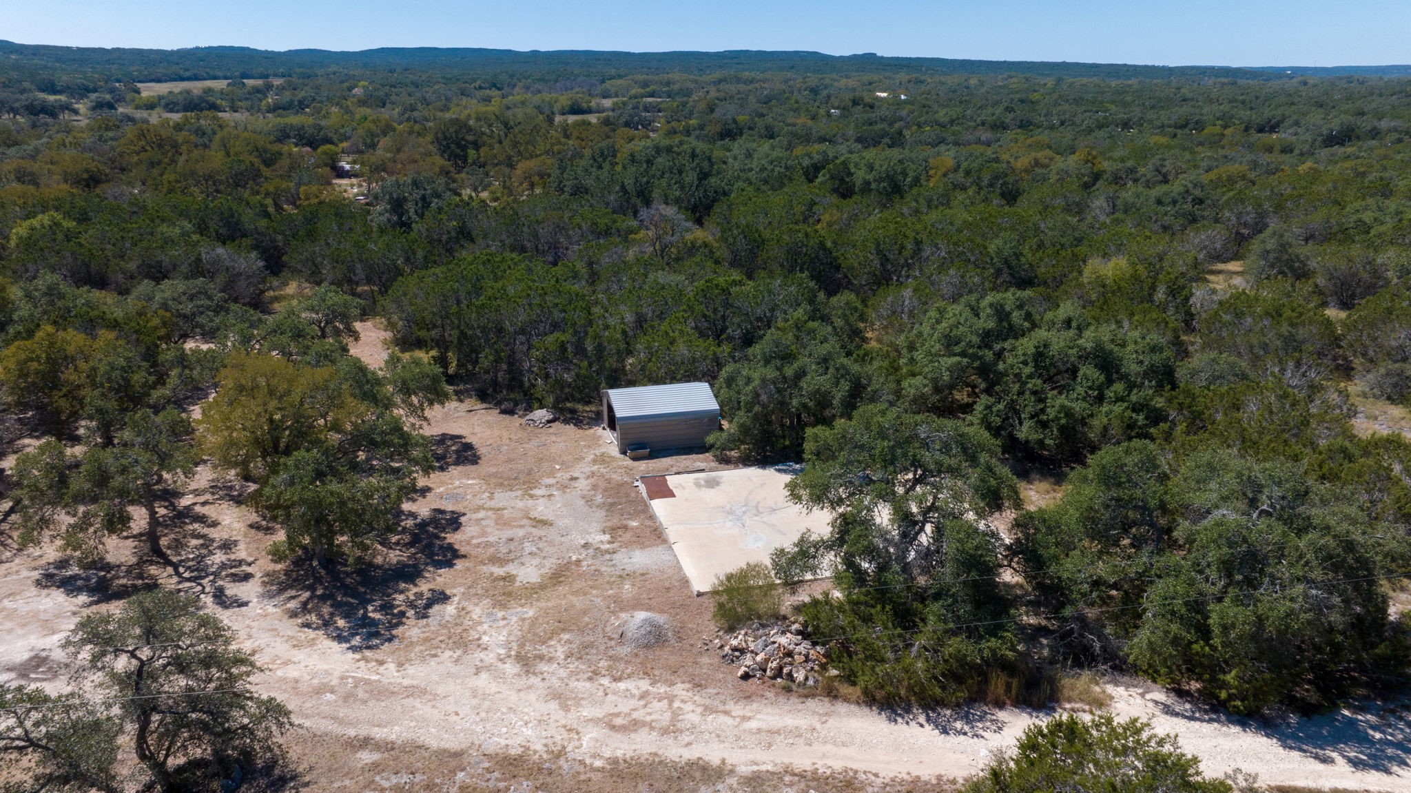 840 Forest View Drive Blanco, TX 78606 - Photo 16 of 32 a view of a forest with a street
