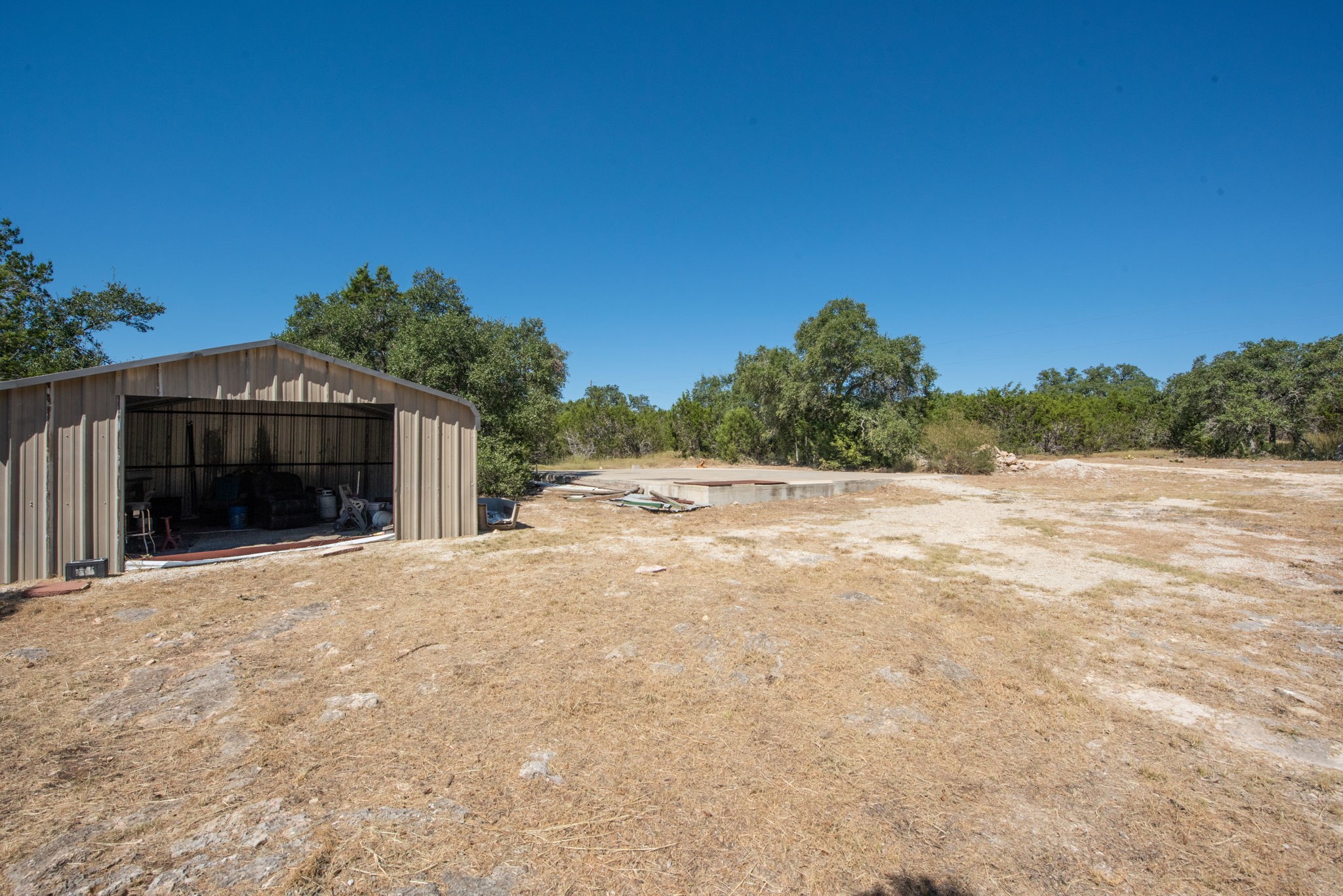 840 Forest View Drive Blanco, TX 78606 - Photo 23 of 32 a view of backyard and trees