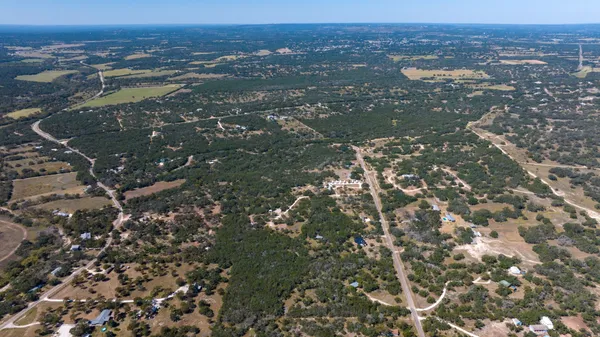 an aerial view of residential house and green space