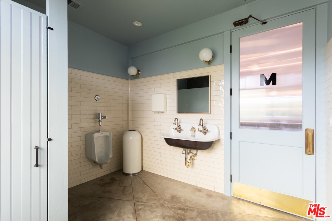 6408 Ruby Street Los Angeles, CA 90042 - Photo 15 of 36 a bathroom with a sink and mirror