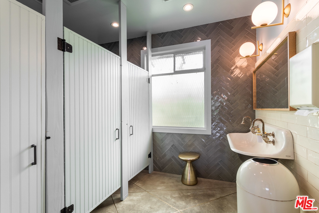 6408 Ruby Street Los Angeles, CA 90042 - Photo 16 of 36 a bathroom with a toilet sink and mirror