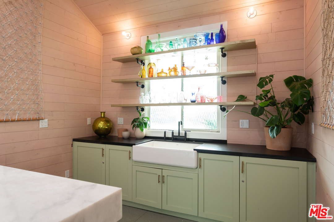 6408 Ruby Street Los Angeles, CA 90042 - Photo 18 of 36 a kitchen with a sink a counter space and a window