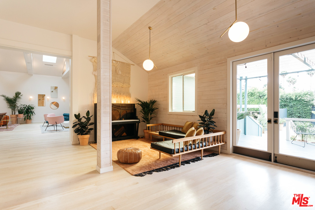 6408 Ruby Street Los Angeles, CA 90042 - Photo 20 of 36 a living room with furniture a chandelier and a large window