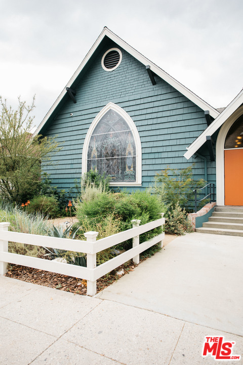 6408 Ruby Street Los Angeles, CA 90042 - Photo 3 of 36 a front view of a house with a yard