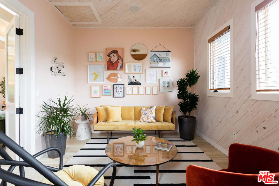 6408 Ruby Street Los Angeles, CA 90042 - Photo 23 of 36 a living room with patio furniture and a potted plant