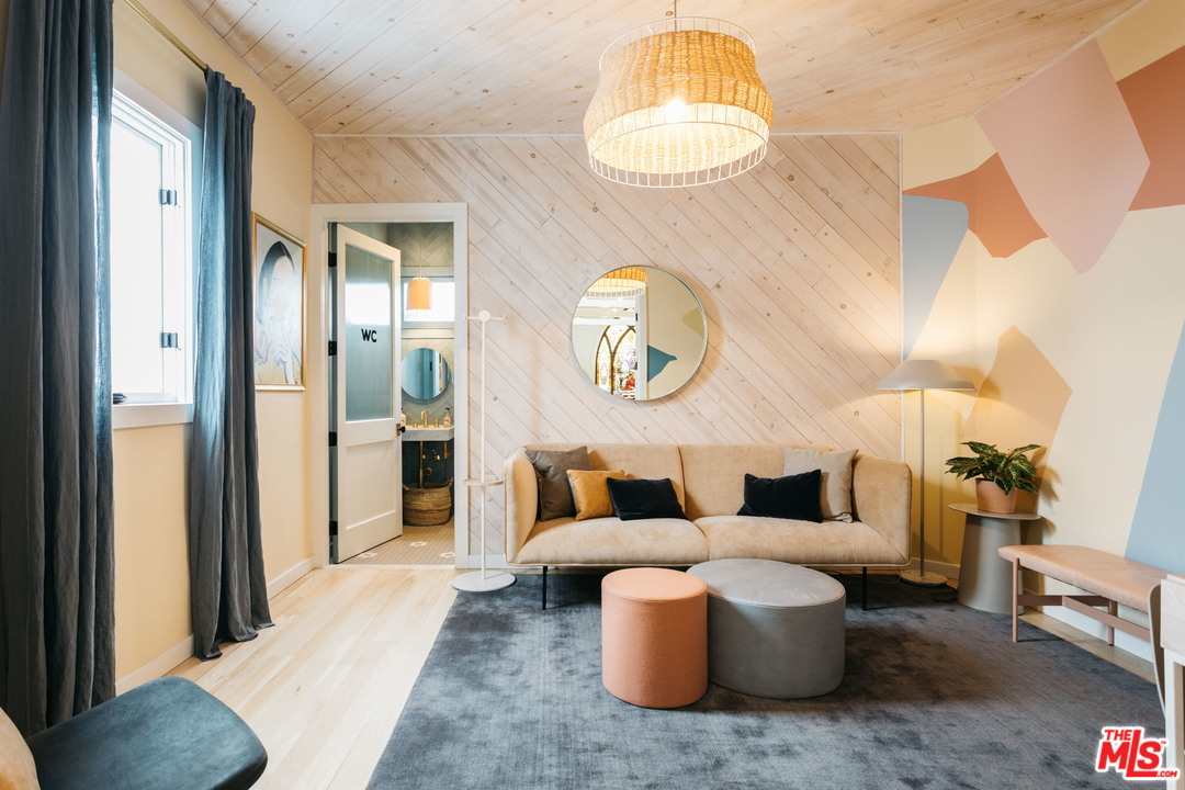 6408 Ruby Street Los Angeles, CA 90042 - Photo 25 of 36 a living room with furniture and a chandelier