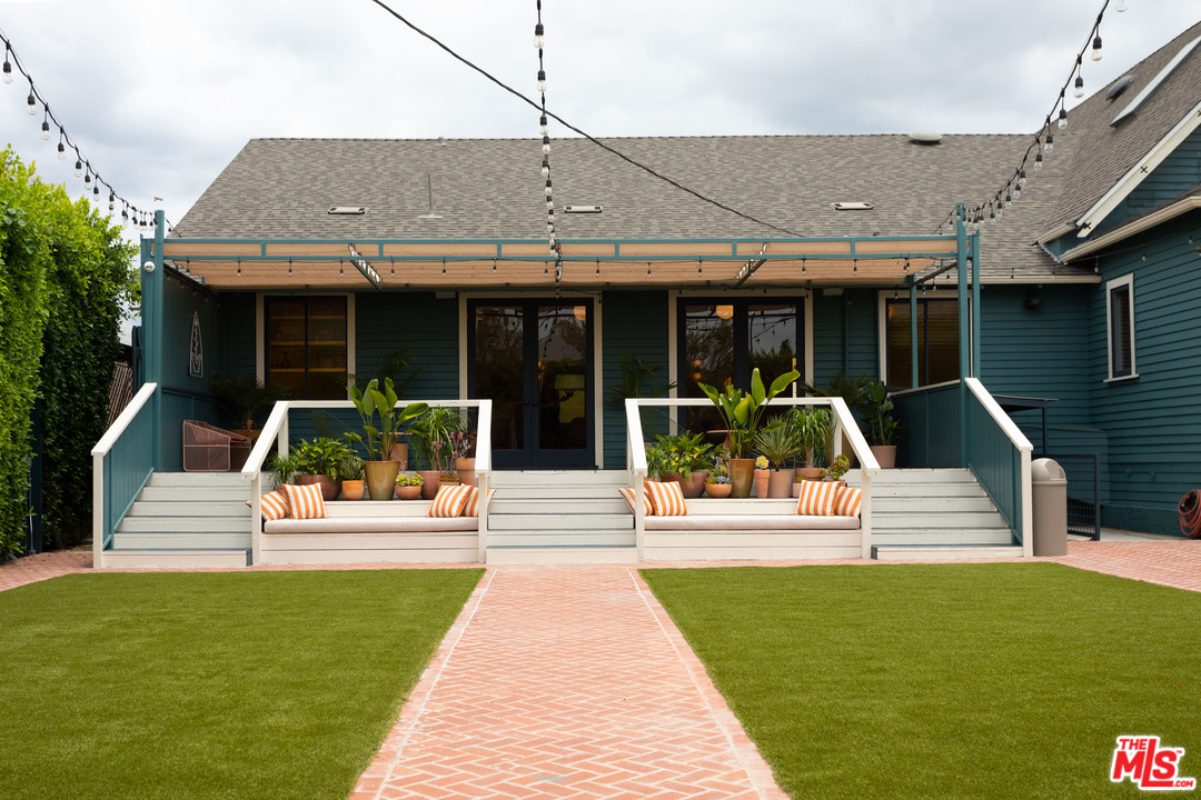 6408 Ruby Street Los Angeles, CA 90042 - Photo 30 of 36 a front view of a house with garden