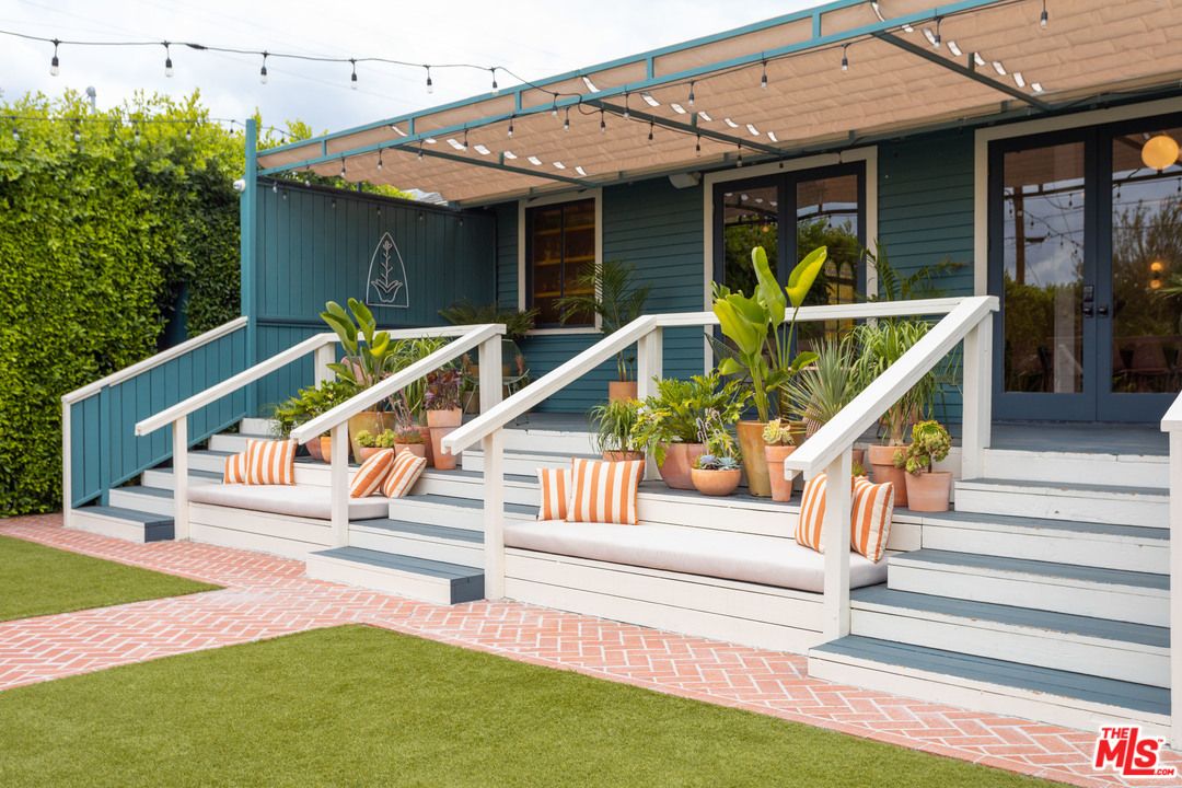6408 Ruby Street Los Angeles, CA 90042 - Photo 33 of 36 a view of house with stairs and wooden fence