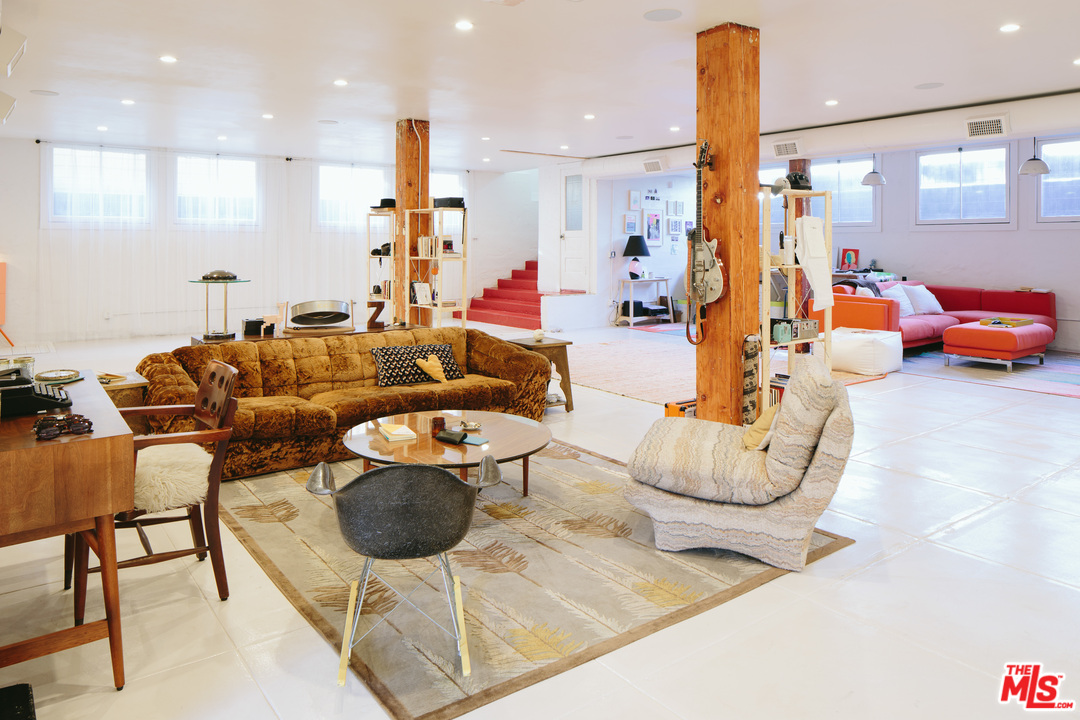 6408 Ruby Street Los Angeles, CA 90042 - Photo 35 of 36 a living room with furniture and a chandelier