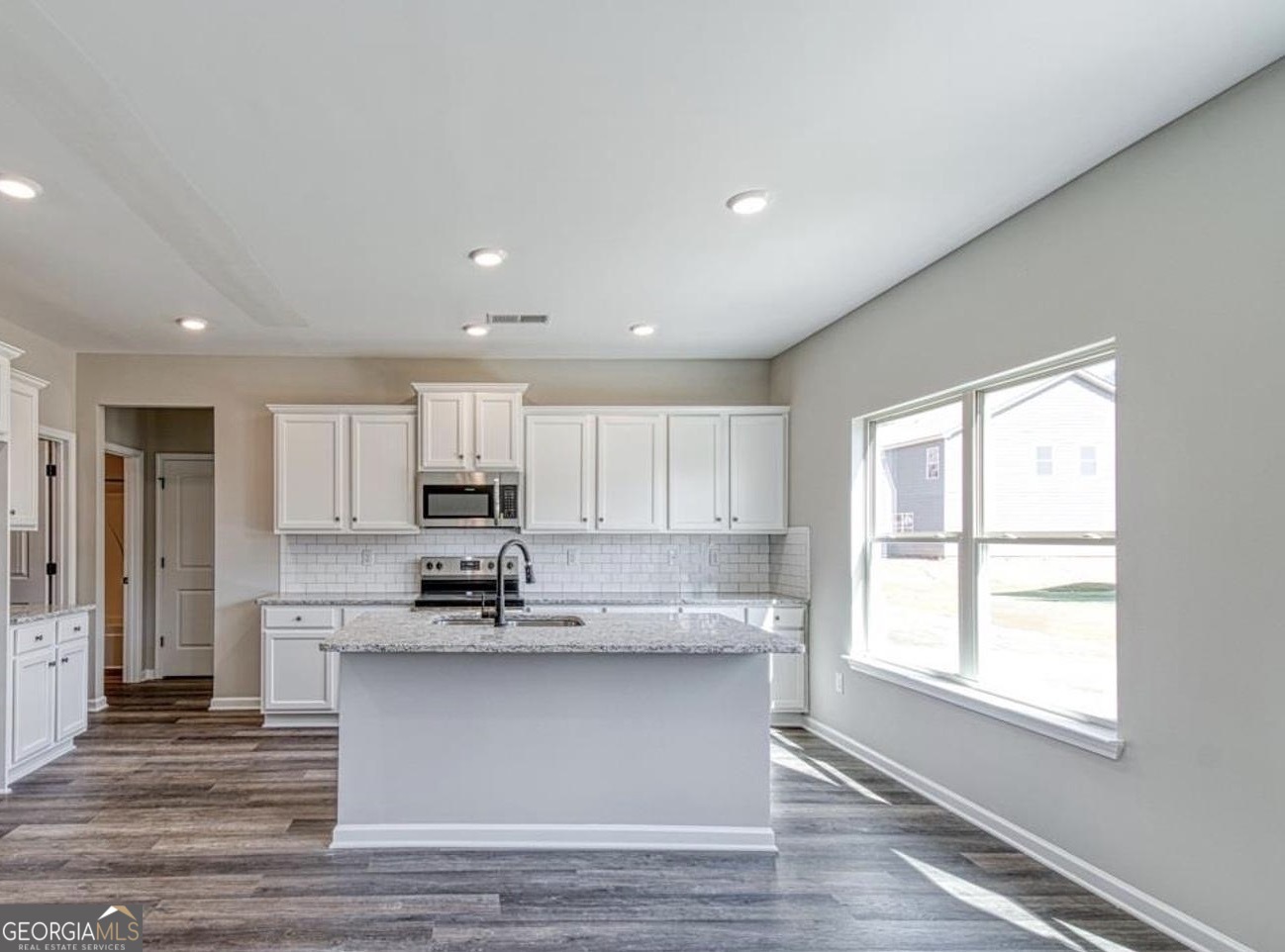 1172 Faulkner Way Jonesboro, GA 30238 - Photo 4 of 9 a view of kitchen with wooden floor and window