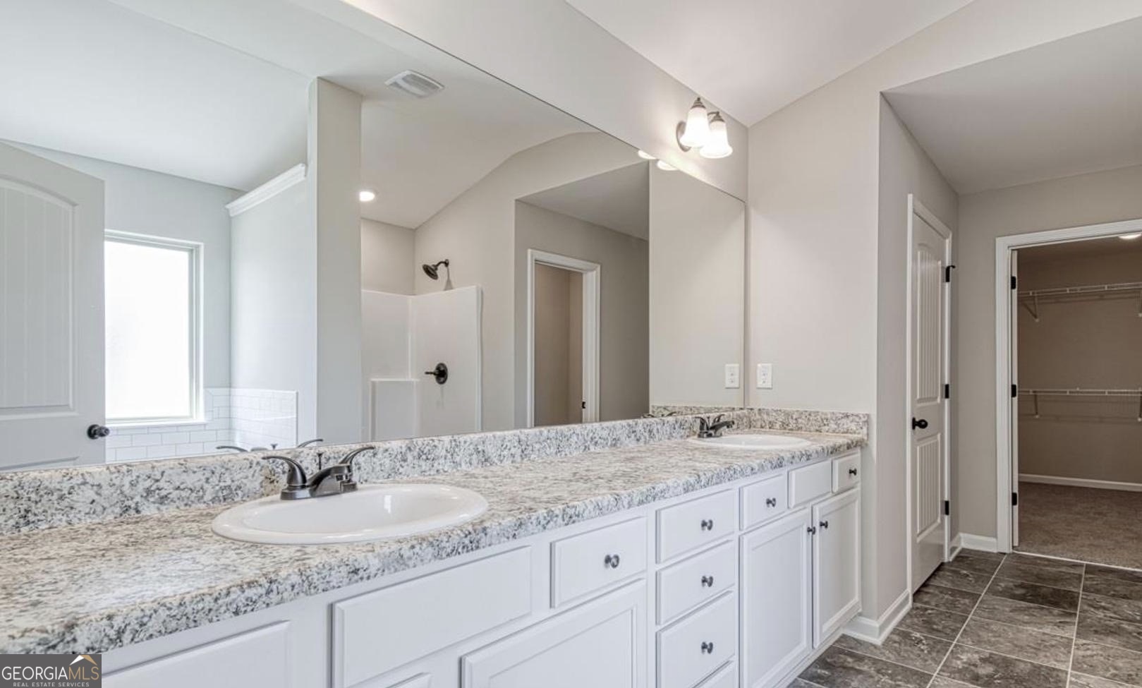 1172 Faulkner Way Jonesboro, GA 30238 - Photo 6 of 9 a bathroom with a granite countertop double sink and a mirror