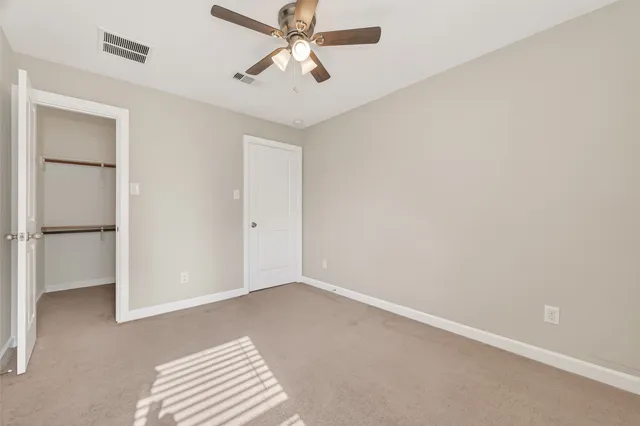 a view of room with ceiling fan
