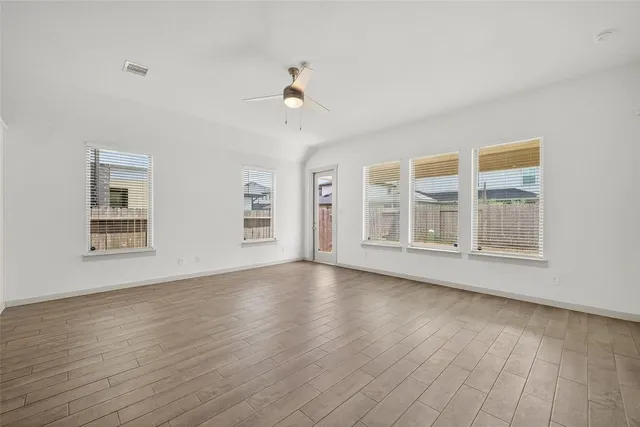 a view of kitchen with wooden floor and window