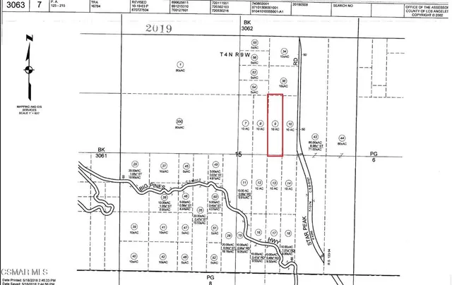 an aerial view of residential building and trees