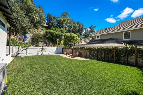 a view of backyard with green space