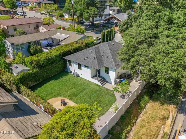 an aerial view of a house with a garden house