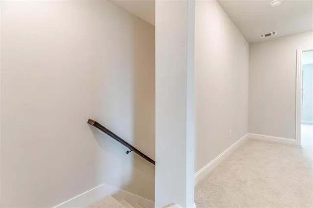 a view of hallway with stairs
