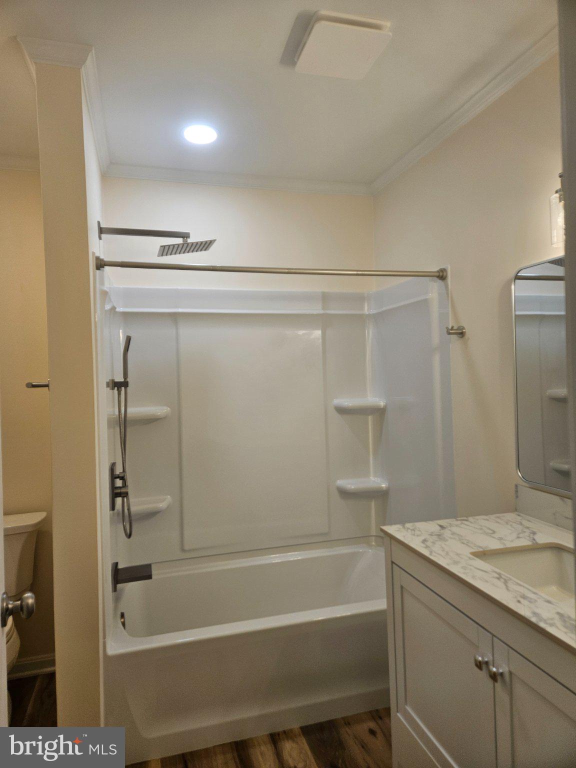 5 7th Street Ridgely, MD 21660 - Photo 7 of 12 a bathroom with a granite countertop sink a toilet and shower