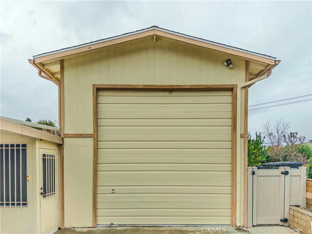 9465 Sharon Way Calimesa, CA 92320 - Photo 21 of 21 a back view of a house with a wooden deck