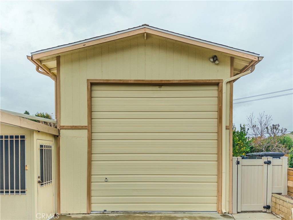 9465 Sharon Way Calimesa, CA 92320 - Photo 5 of 21 a back view of a house with a wooden deck