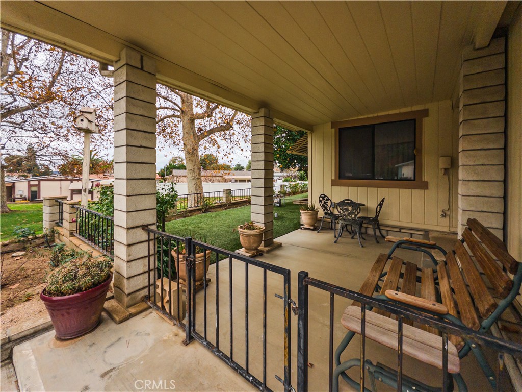 9465 Sharon Way Calimesa, CA 92320 - Photo 10 of 21 a view of a patio with chairs and potted plants