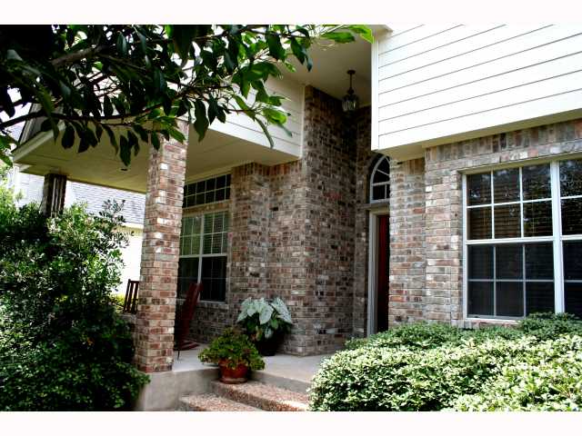 a view of a house with a tree