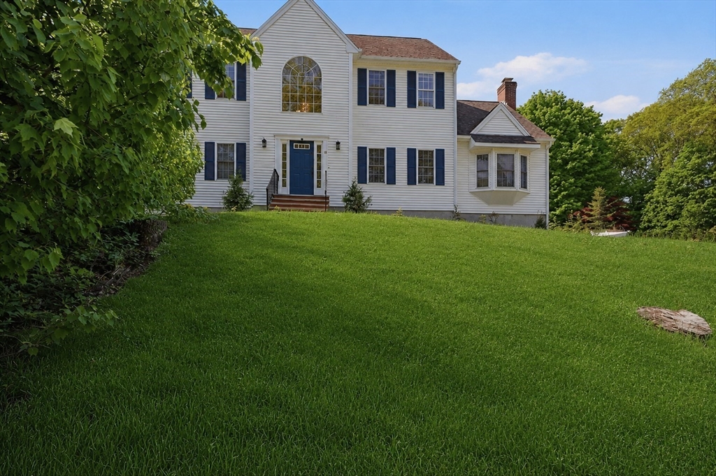 61 Indian Head Road Framingham, MA 01701 - Photo 2 of 42 a front view of a house with a yard