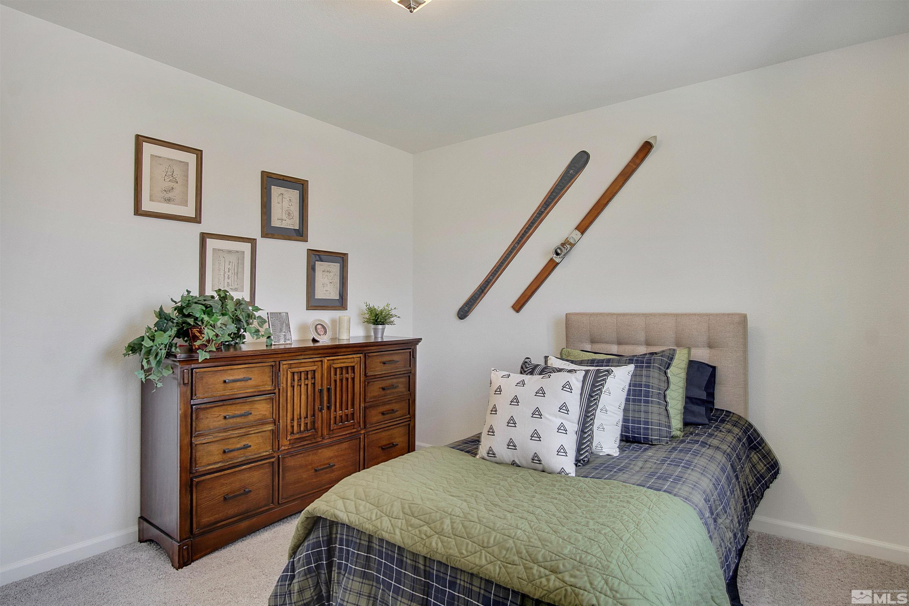 9320 Carter Reno, NV 89506 - Photo 5 of 7 a bedroom with a bed and a dresser