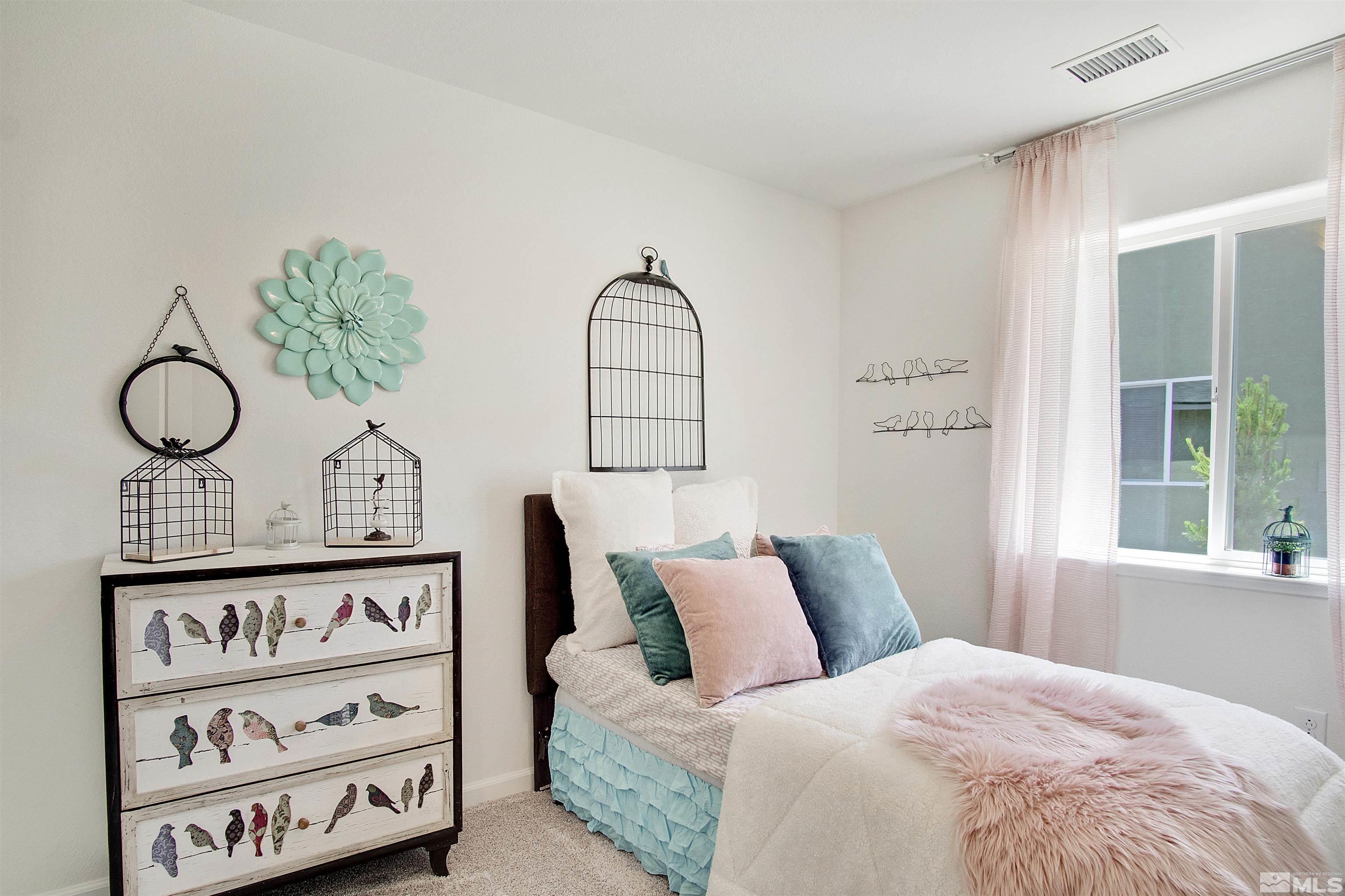 9320 Carter Reno, NV 89506 - Photo 6 of 7 a bedroom with a bed and a painting on the wall