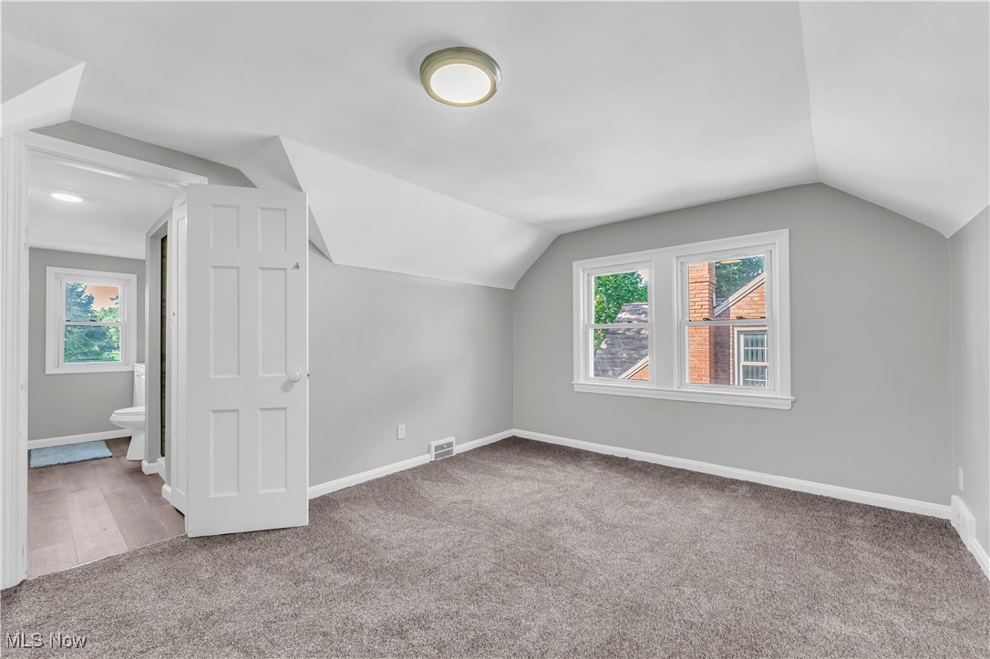 2425 Canterbury Road Cleveland Heights, OH 44118 - Photo 25 of 33 Bonus room featuring carpet, a wealth of natural light, and vaulted ceiling