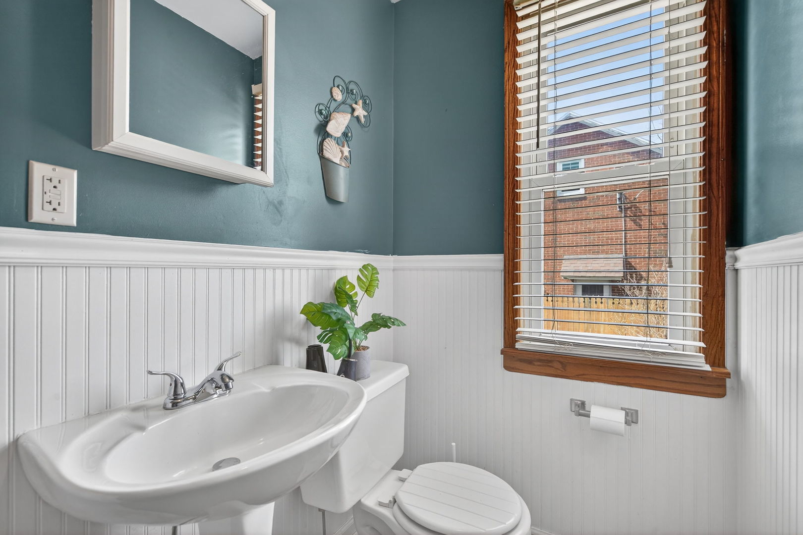 206 West Delaware Street Dwight, IL 60420 - Photo 12 of 42 a bathroom with a sink and a toilet